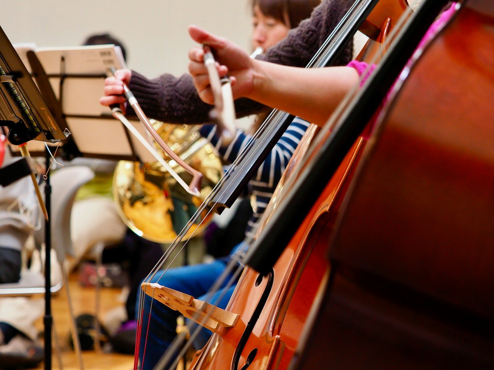 A group of people playing musical instruments in a room